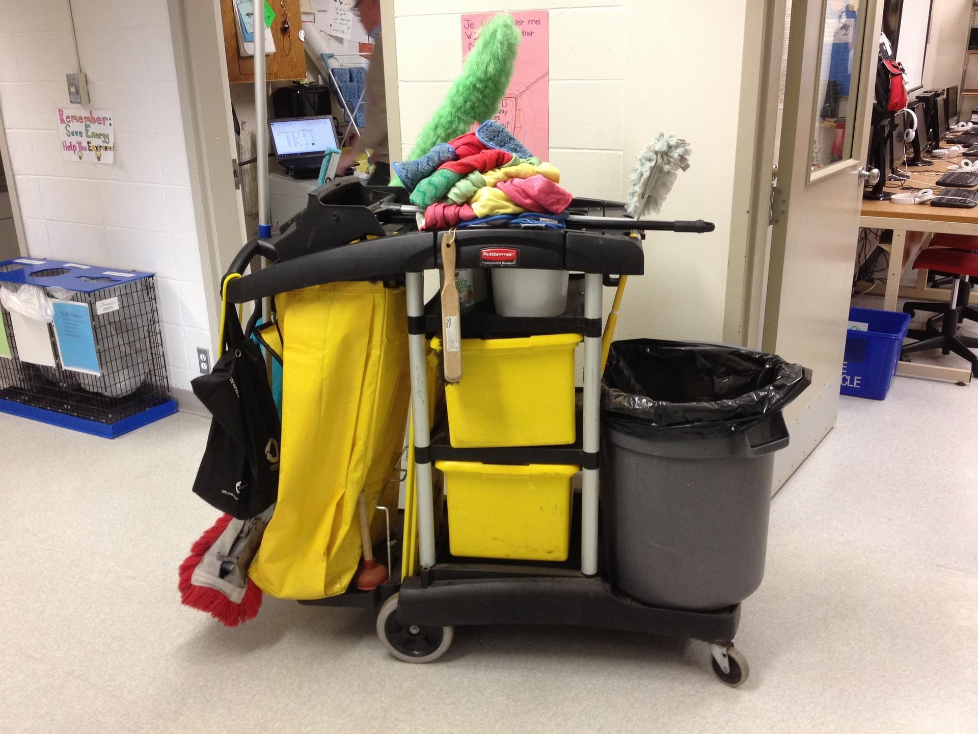 Fully stocked janitorial cart with cleaning supplies ready for day porter service in a commercial facility
