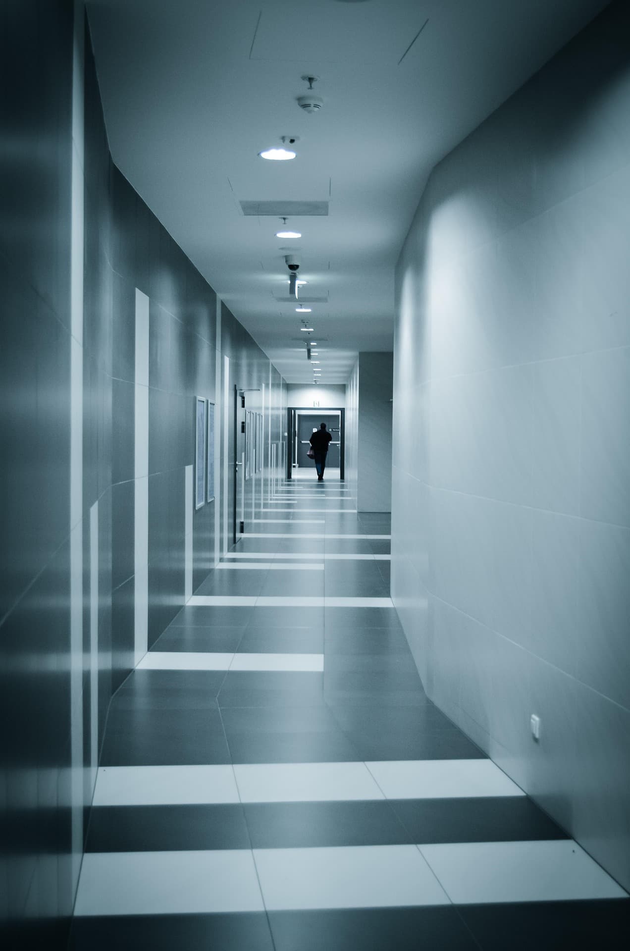 Clean modern corridor with polished floors and strong perspective lines